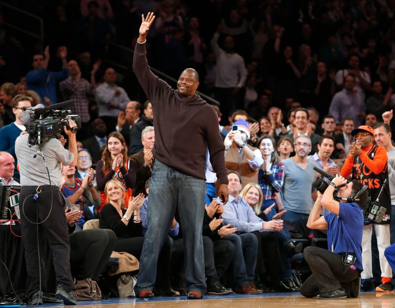 Former New York Knicks player Patrick Ewing waves to fans while attending the Knicks NBA basketball game against the Los Angeles Lakers in New York