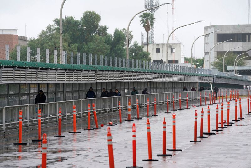 People cross into the U.S. as efforts to try to slow the spread of the coronavirus disease continues in Laredo