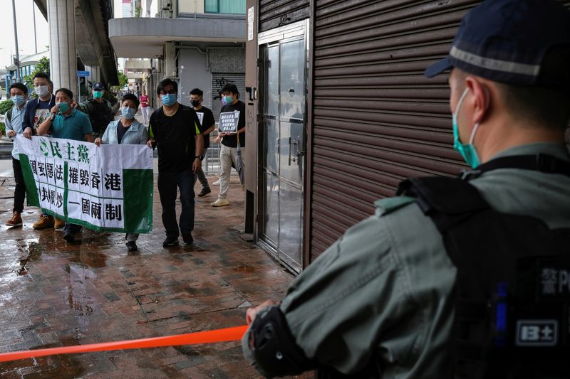 Activists march against new security laws, near China's Liaison Office, in Hong Kong