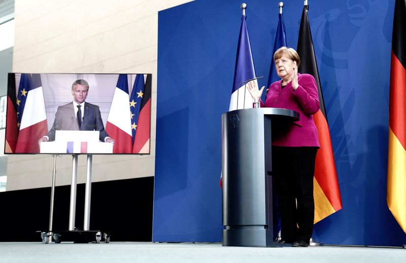 German Chancellor Angela Merkel holds a joint video news conference with French President Emmanuel Macron
