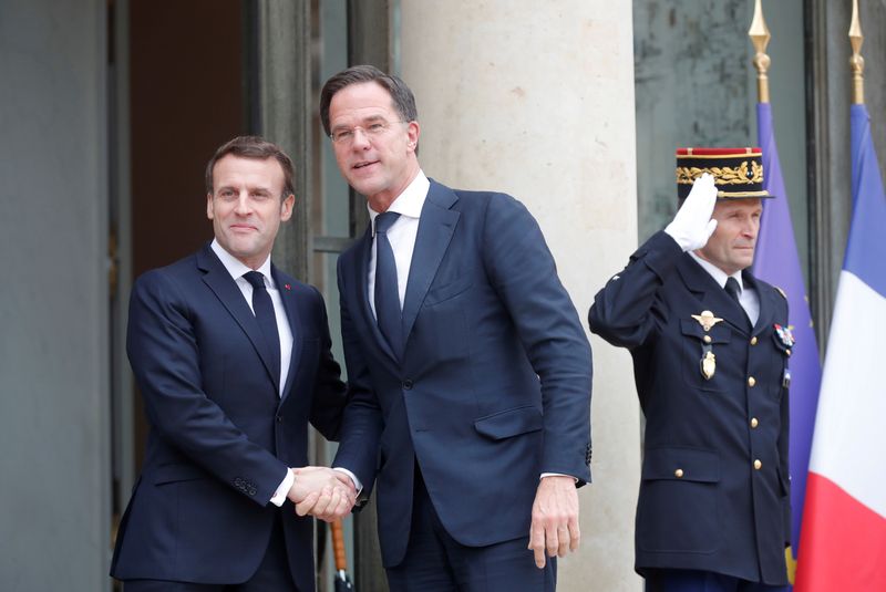 FILE PHOTO: French President Emmanuel Macron welcomes Dutch Prime Minister Mark Rutte at the Elysee Palace in Paris