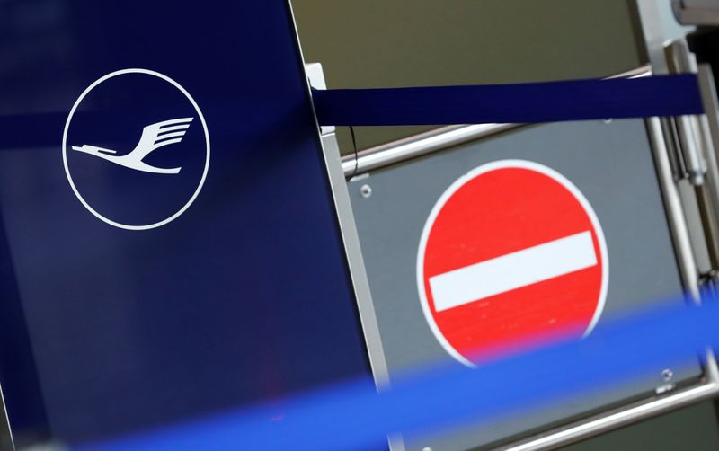 Logo of German airlines Lufthansa is pictured next to a no-entry sign at Frankfurt Airport