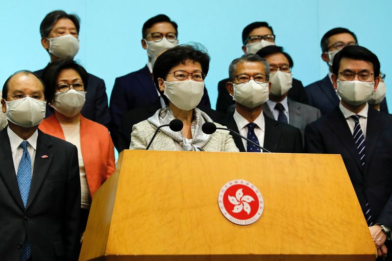 FILE PHOTO: Hong Kong Chief Executive Carrie Lam, wearing a face mask following the coronavirus disease (COVID-19) outbreak, attends a news conference with officers over Beijing’s plans to impose national security legislation in Hong Kong