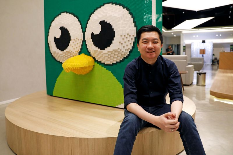 FILE PHOTO: Founder and CEO of Indonesian e-commerce firm Tokopedia, William Tanuwijaya, poses for a photograph at Tokopedia headquarters in Jakarta