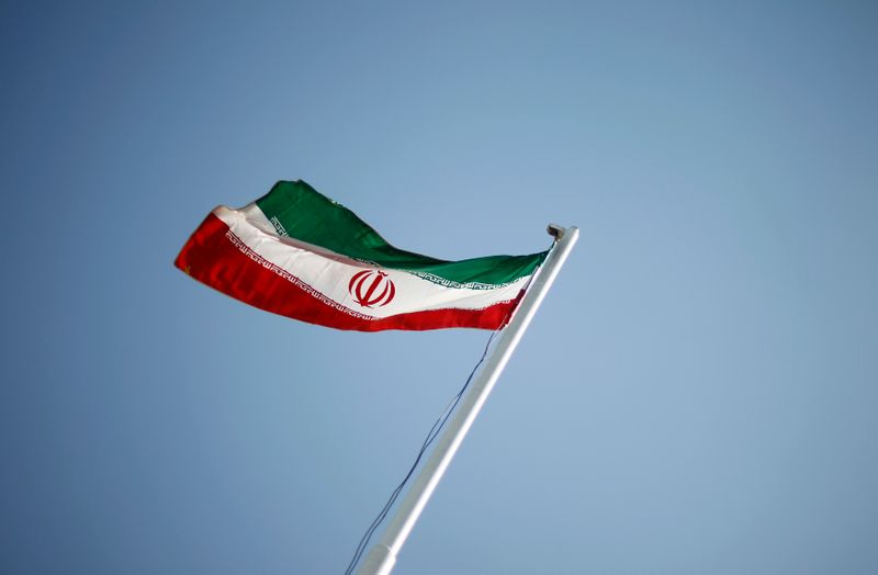 An Iranian national flag flutters during the opening ceremony of the 16th International Oil, Gas & Petrochemical Exhibition (IOGPE) in Tehran