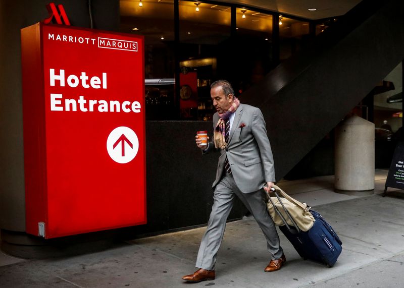 A guest arrives at the Marriott Marquis hotel in Times Square in New York