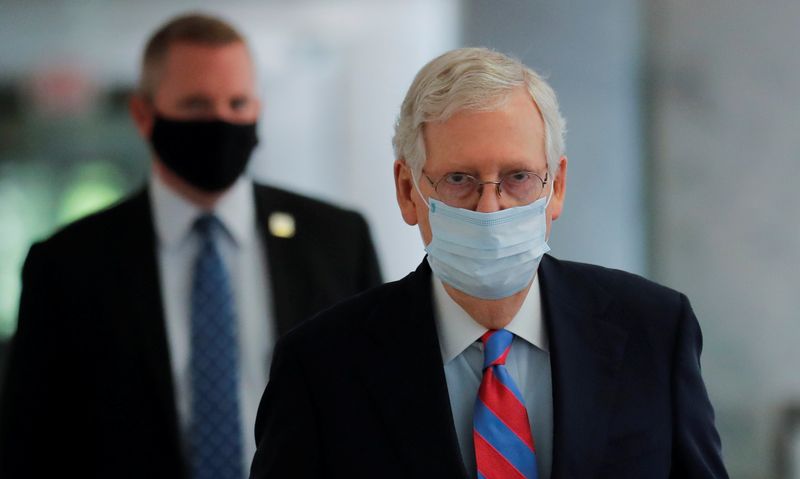 U.S. Senate Majority Leader Mitch McConnell walks down a hallway during coronavirus outbreak on Capitol Hill in Washington