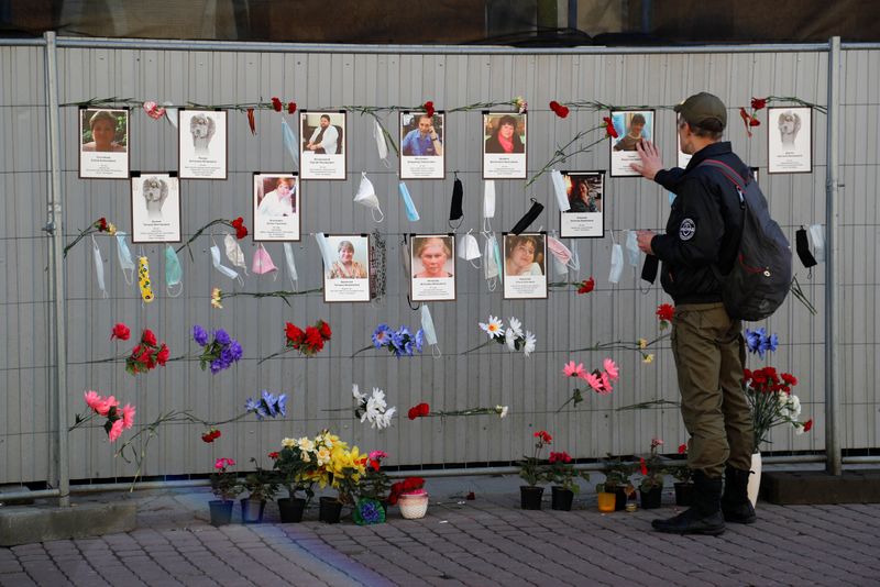 A man visits a makeshift memorial for medics, who reportedly died in Saint Petersburg and Leningrad Region in the times of the coronavirus disease outbreak, in Saint Petersburg