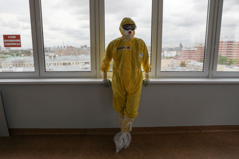 A medical worker takes a break at a hospital, where patients suffering from the coronavirus disease (COVID-19) are treated, in Moscow