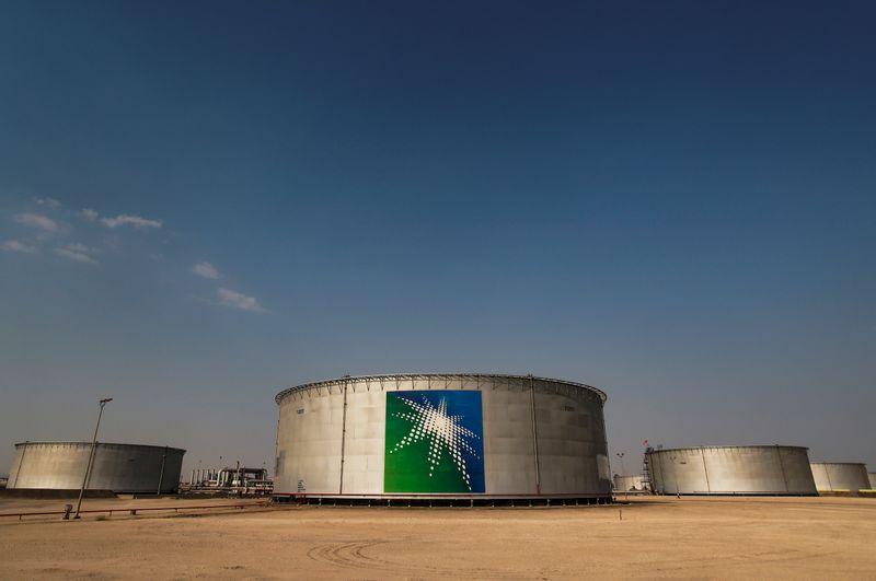 FILE PHOTO: Branded oil tanks at a Saudi Aramco oil facility in Abqaiq