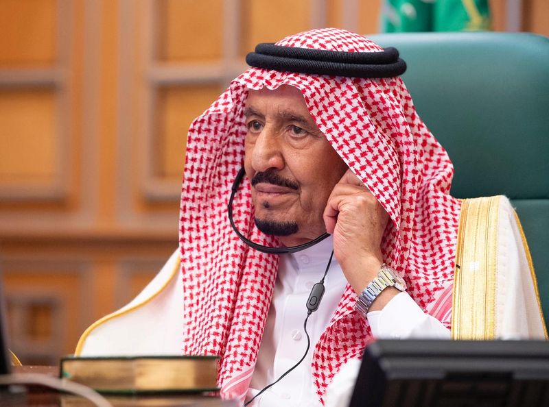 FILE PHOTO: Saudi King Salman bin Abdulaziz attends via video link a virtual G20 summit on coronavirus disease (COVID-19), in Riyadh