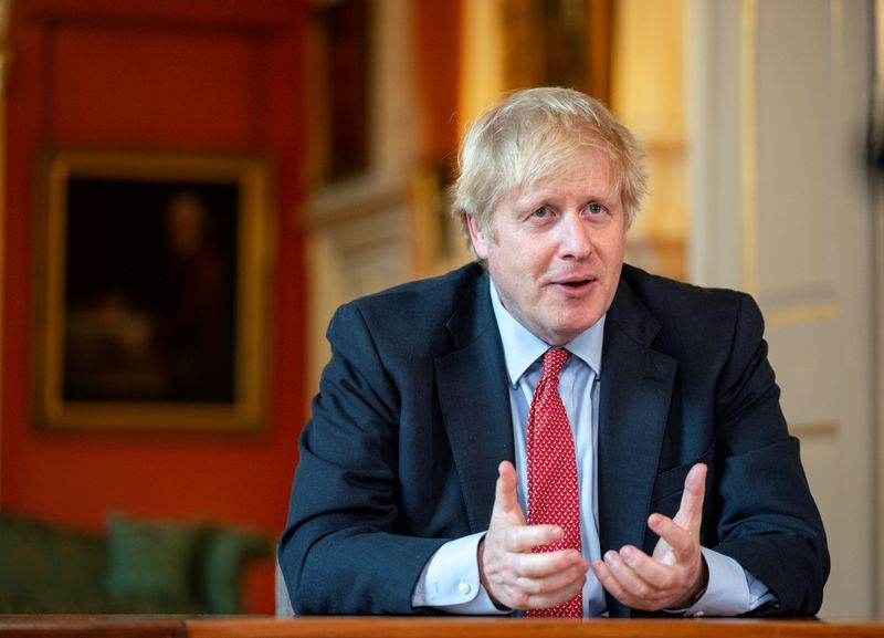 FILE PHOTO: Britain's PM Johnson records video message for Captain Moore's 100th birthday in London