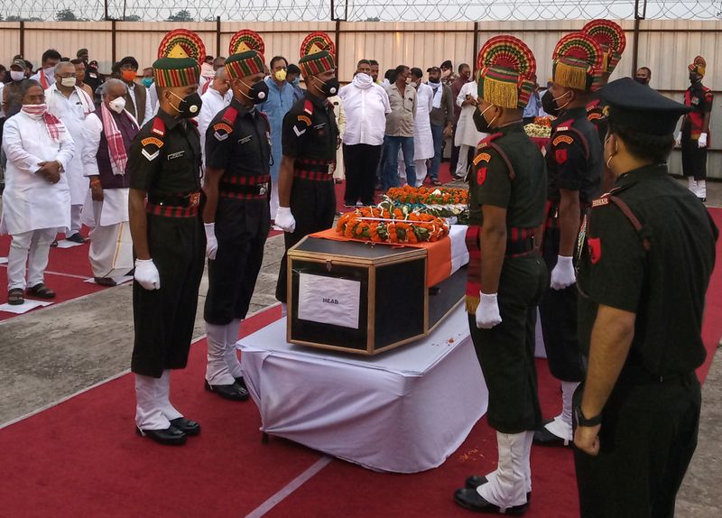 Indian army soldiers stand around the coffin of their colleague, who was killed in a border clash with Chinese troops in Ladakh region, during a wreath laying ceremony in Patna