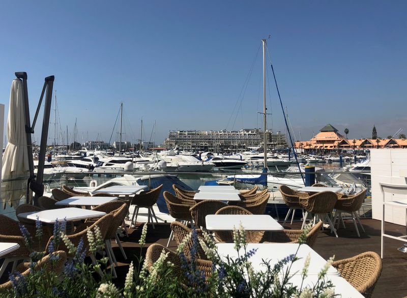 FILE PHOTO: An empty restaurant terrace is pictured amid concerns over the coronavirus (COVID-19) spread, at the Vilamoura marina in Algarve region