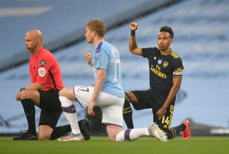 Soccer: Players take a knee as Premier League restarts