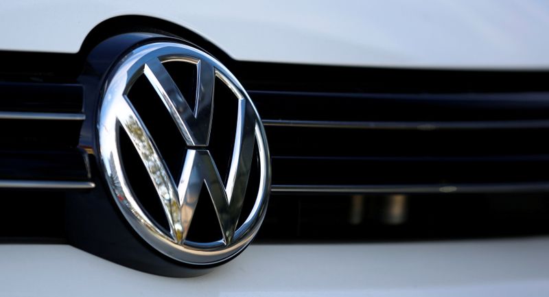 FILE PHOTO: The logo of German car maker Volkswagen is seen on a car outside a garage in Vienna