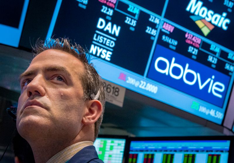 A trader works by the post that trades AbbVie on the floor of the New York Stock Exchange