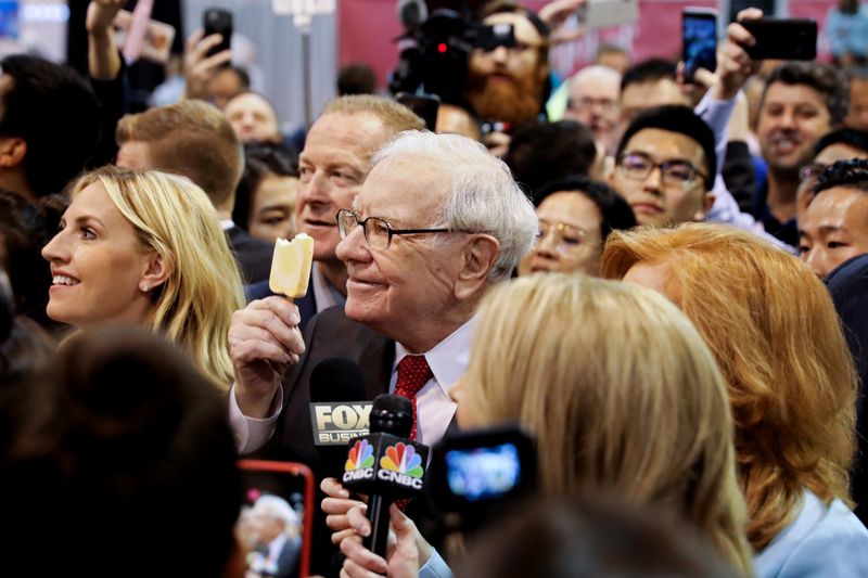 Berkshire Hathaway Chairman Warren Buffett walks through the exhibit hall as shareholders gather to hear from the billionaire investor at Berkshire Hathaway Inc's annual shareholder meeting in Omaha