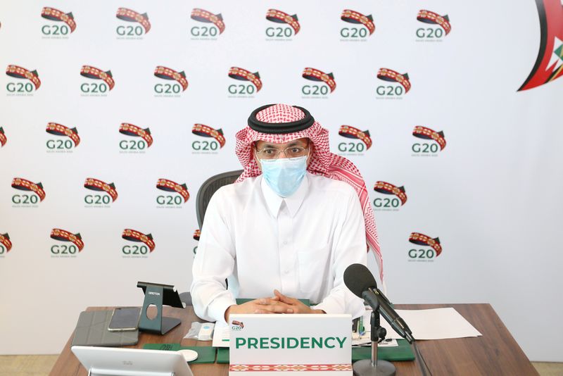Saudi Minister of Finance Mohammed al-Jadaan wears a protective mask as he attends a virtual meeting of G20 finance ministers and central bank governors in Riyadh