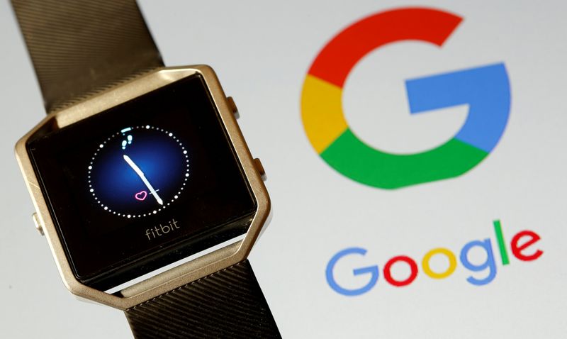 FILE PHOTO: Fitbit Blaze watch is seen in front of a displayed Google logo in this illustration