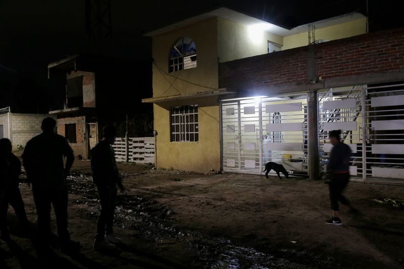 Members of the media stand outside a drug rehabilitation facility where assailants killed several people according to Guanajuato state police, in Irapuato, Mexico