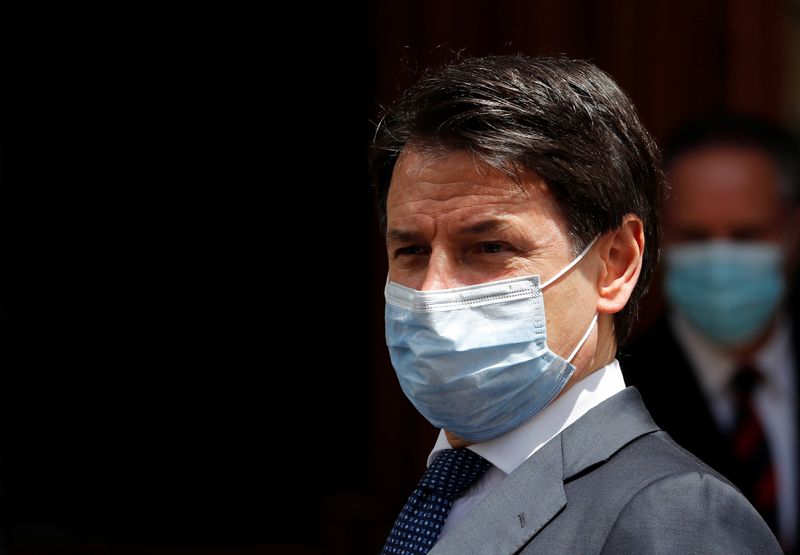 Italian Prime Minister Giuseppe Conte wearing a protective face mask, leaves the Senate as the spread of the coronavirus disease (COVID-19) continues, in Rome