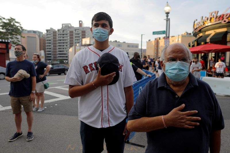 FILE PHOTO: Fans gather outside Fenway Park for Baltimore Orioles and Boston Red Sox season opening baseball game in Boston