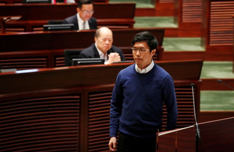 FILE PHOTO: Newly-elected lawmaker Au Nok-hin walks after swearing in at the Legislative Council in Hong Kong, China