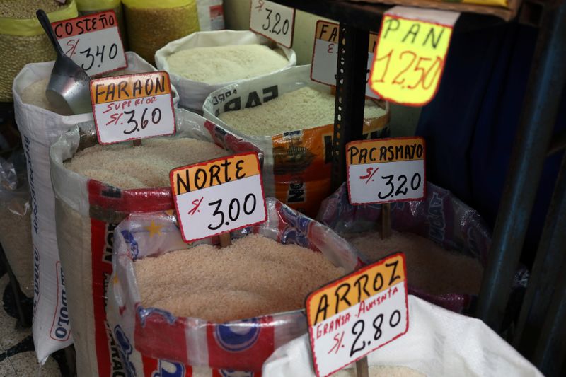 Rice and groceries are display for sale at a stand at Surco market in Lima