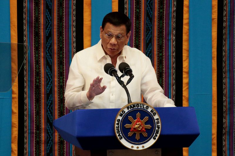 FILE PHOTO: Philippine President Rodrigo Duterte gestures during his fourth State of the Nation Address at the Philippine Congress in Quezon City