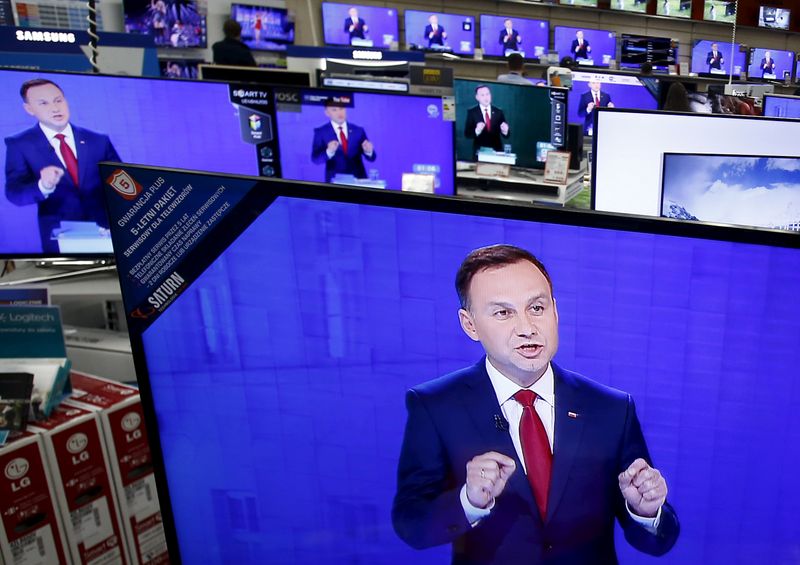 FILE PHOTO: Andrzej Duda is seen on television screens at a shopping mall in Warsaw