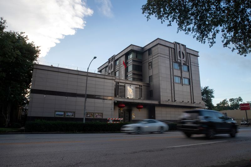 FILE PHOTO: Vehicles pass by the China Consulate General in Houston, Texas