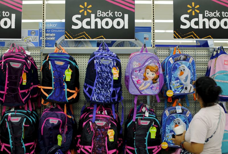 FILE PHOTO: A woman shops for back to school supplies at a Walmart store in San Diego, California