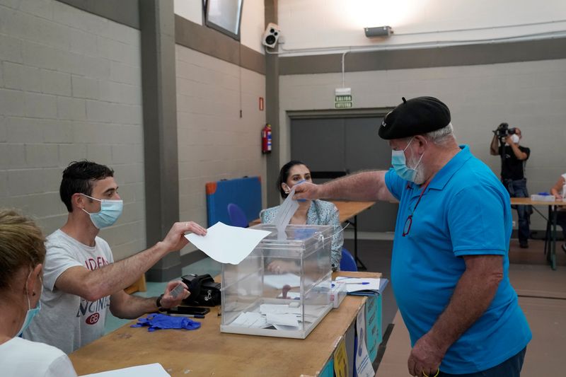 A man votes at a polling station during the Basque regional elections, amid the coronavirus disease (COVID-19) outbreak, in Durango
