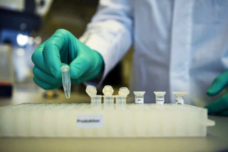 FILE PHOTO: Employee Philipp Hoffmann, of German biopharmaceutical company CureVac, demonstrates research workflow on a vaccine for the coronavirus (COVID-19) disease at a laboratory in Tuebingen