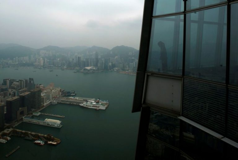 Hong Kong cuts full year economic outlook, recovery depends on virus control