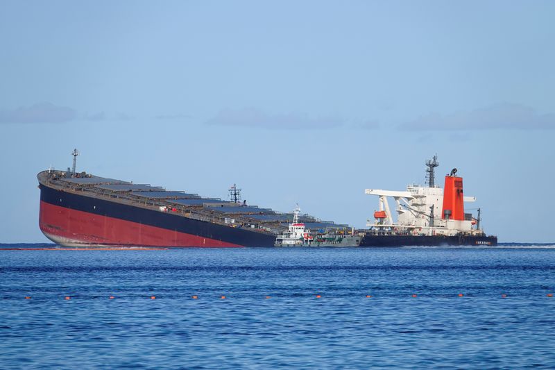 FILE PHOTO: A general view shows the bulk carrier ship MV Wakashio, belonging to a Japanese company but Panamanian-flagged, that ran aground on a reef, at Riviere des Creoles