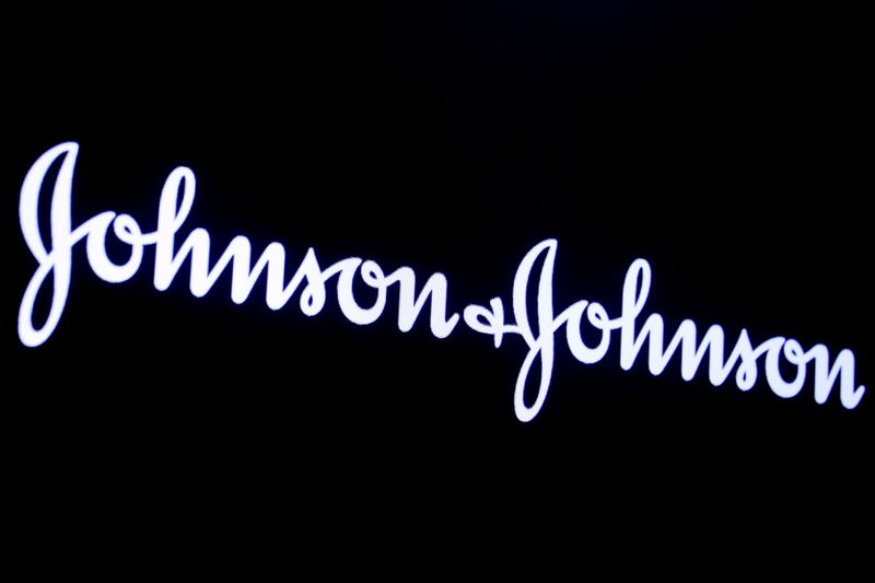 FILE PHOTO: The company logo for Johnson & Johnson is displayed on a screen to celebrate the 75th anniversary of the company's listing at the NYSE in New York