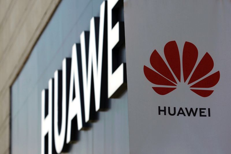FILE PHOTO: Huawei sign is seen outside its store at a shopping complex in Beijing