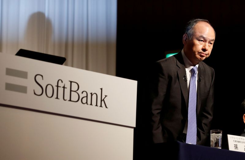 FILE PHOTO: Japan's SoftBank Group Corp Chief Executive Masayoshi Son attends a news conference in Tokyo