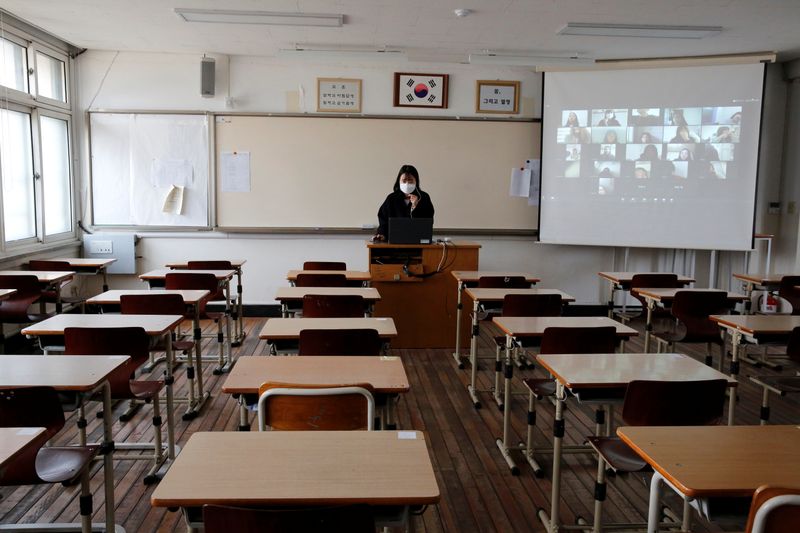 A teacher gives an online class at school, amid the coronavirus disease (COVID-19) outbreak, in Seoul