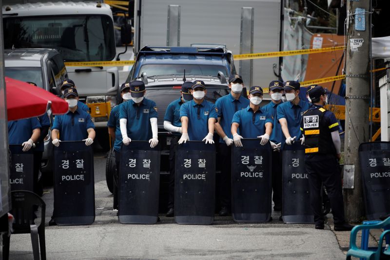 South Korean police stand guard near the Sarang Jeil Church, which has become a new cluster of coronavirus disease (COVID-19) infections, in Seoul