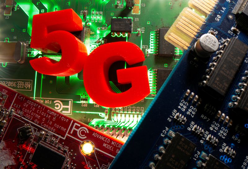 3d printed objects representing 5G are put on a motherboard in this picture illustration