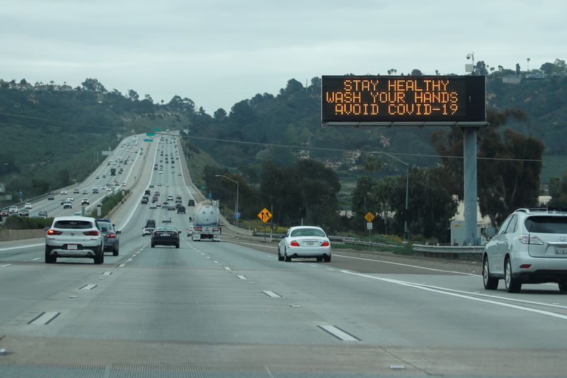 A traffic highway sign on a usually busy interstate 5 freeway informs drivers to wash their hands due to the global outbreak of the coronavirus disease (COVID-19), in La Jolla