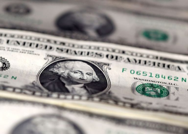 Dollar off two-month peak but on course for best week in six months