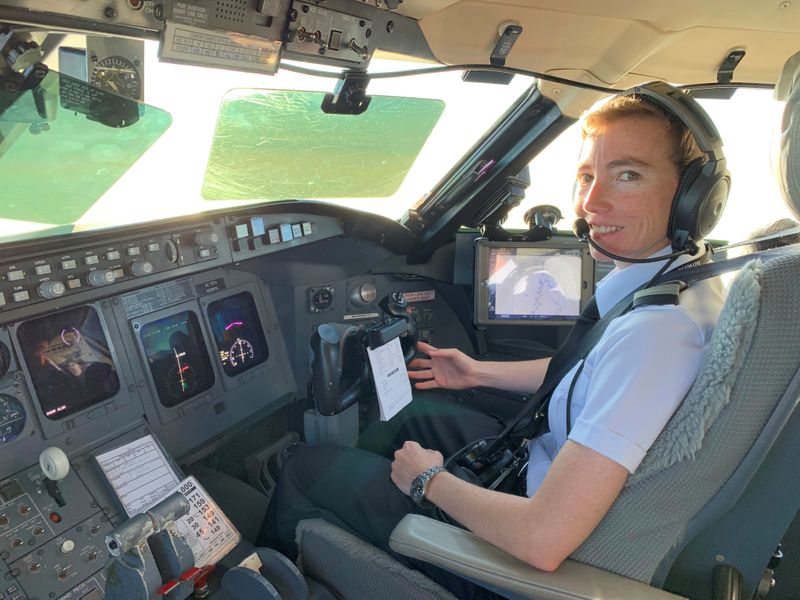PSA pilot Megyn Thompson in the cockpit of a Bombardier CRJ jet near Washington