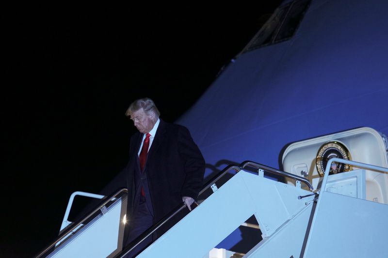 U.S. President Donald Trump descends from Air Force One following a campaign trip to Ohio, at Joint Base Andrews in Maryland