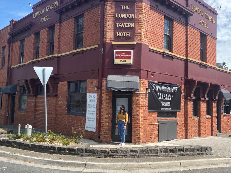 FILE PHOTO: Gina Cimarosti, manager of the London Tavern Hotel, stands outside her empty pub in Melbourne