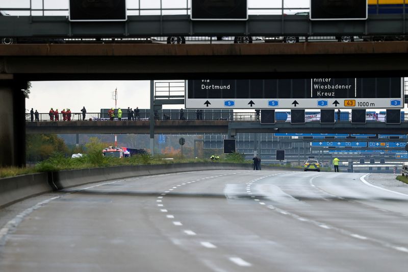 Activists hang on a bridge of A5 highway near Frankfurt causing traffic jams