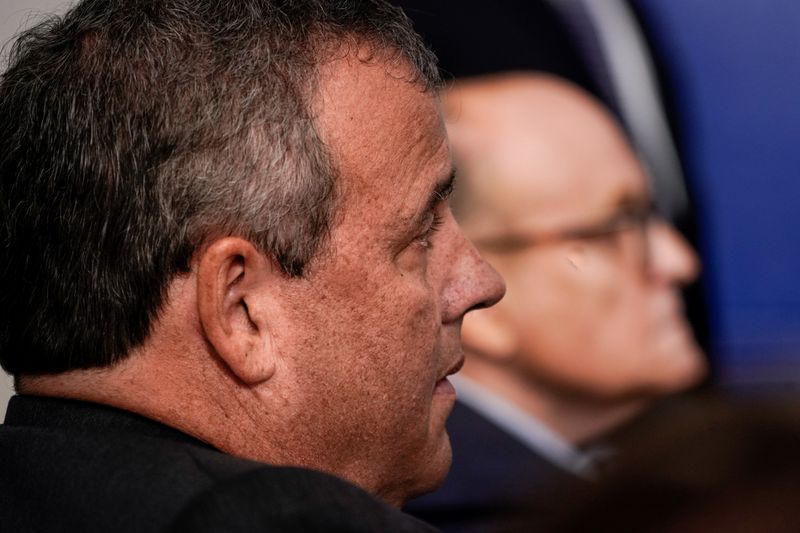 FILE PHOTO: Chris Christie listens to U.S. President Trump speaks to reporters during a news conference